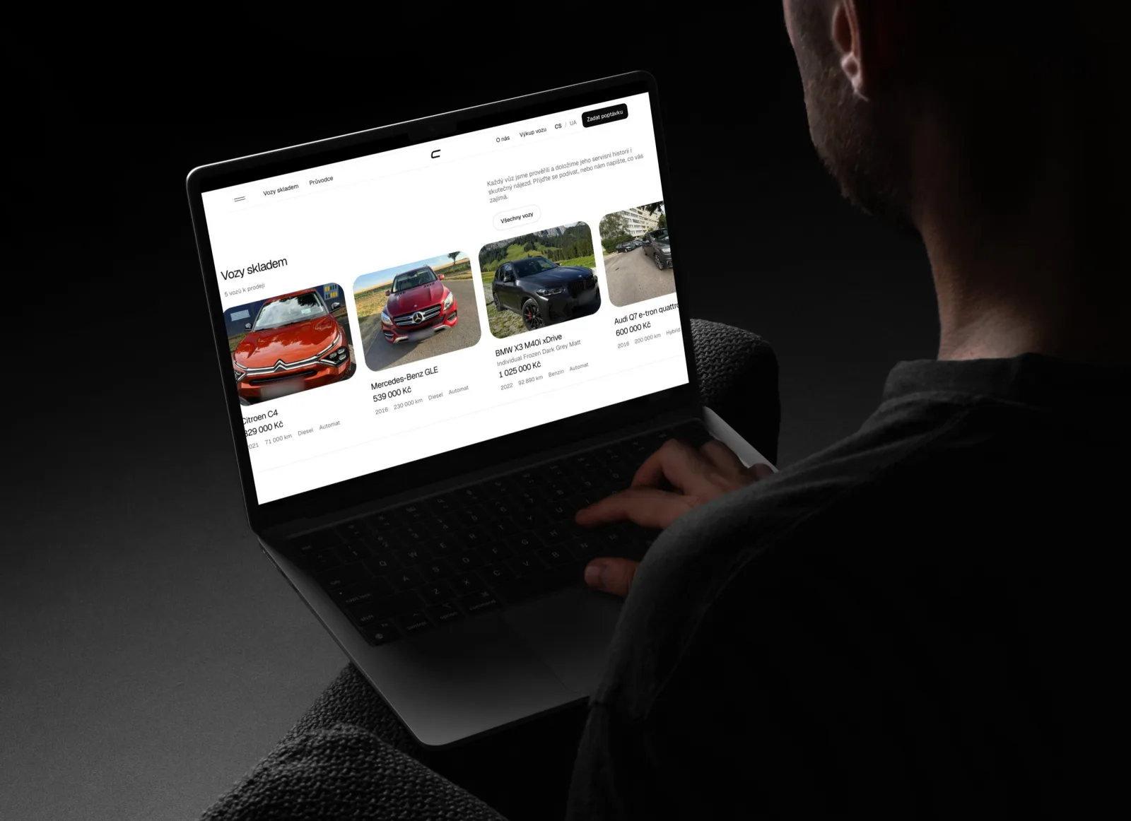 The stock rail in use: a person at a laptop in a dark room